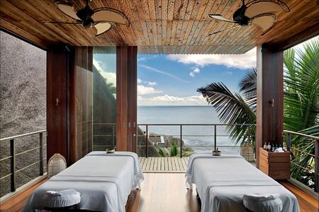 spa treatment room set up for a couples massage at six senses zil payson seychelles