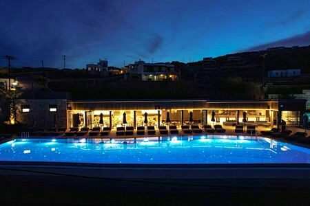 Aeonic Suites and Spa Mykonos Cove bar at night