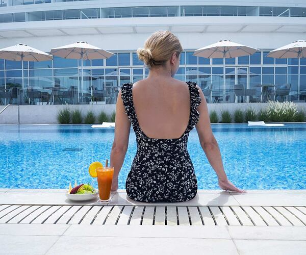 Relaxing by the pool at ZOYA Health and Wellbeing Resort Ajman