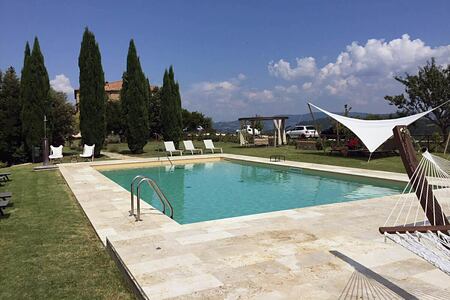 Pool and shade at Locanda Cugnanello Tuscany Italy