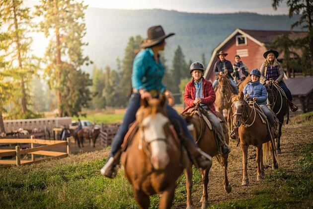 Family horse riding at Three Bars Ranch Canada