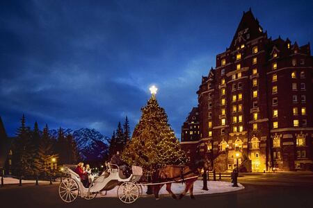 Horse drawn carriage at night at Fairmont Banff Springs Canada