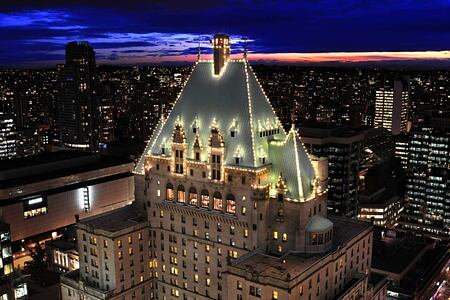 Night view of city and lit-up view of Fairmont Hotel Vancouver Canada