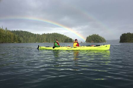 Sea Kayaking with rainbow at Farewell Harbor Lodge Canada
