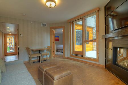 Suite lounge with door to patio at Moose Hotel and Suites Canada