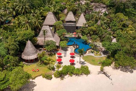 Aerial view of beach and villas at Anantara Maia Seychelles