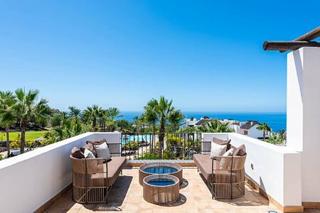Terrace with chairs at 2 Bedroom Suite Partial Sea View at Las Terrazas de Abama Suites Tenerife